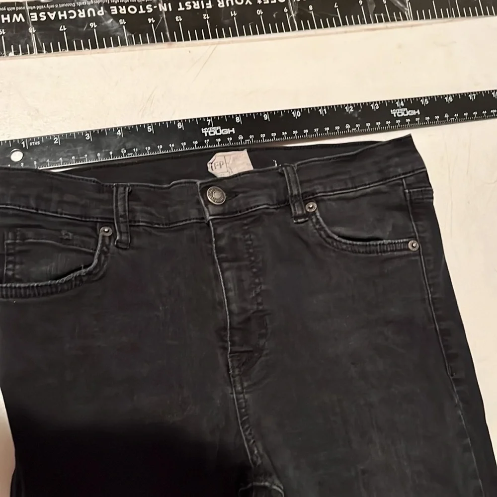 Free People size 27 Black Wash skinny jeans distressed with raw hem